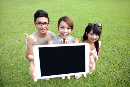happy students in campus show digital tablet, asianの写真素材