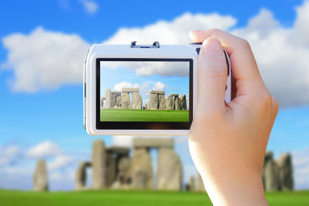 camera taking photo with Stonehenge, Stonehenge an ancient prehistoric stone monument near Salisbury, Wiltshire, UK.の写真素材