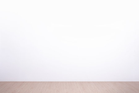 white concrete wall and wood floor