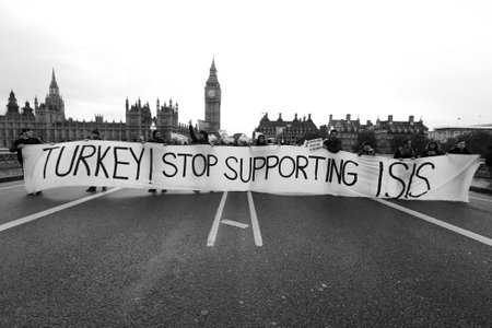 LONDON, England - OCTOBER 09, 2014: People appeal Turkey stop supporting ISIS in London with big ben, UK.のeditorial素材