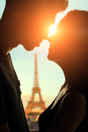 silhouette of romantic lovers with eiffel tower in Paris with sunsetの写真素材