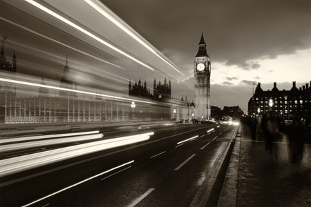 Monochrome Big Ben and London at night with the lights of the cars passing by after rain, London and...