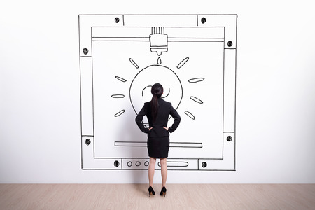 Back view of business woman look hand drawing 3D printer white wall background, asianの写真素材