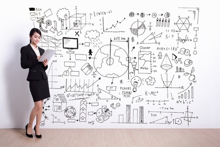 Business woman using digital tablet pc computer with hand drawing infographic , asianの写真素材