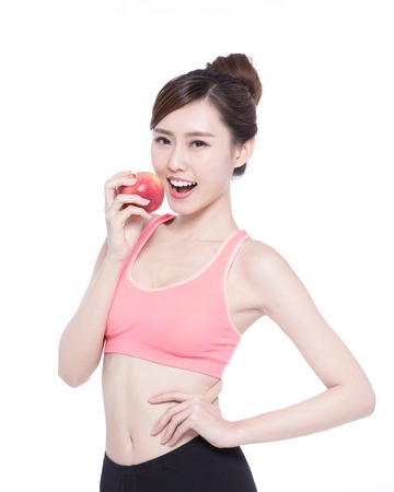 Happy health woman show apple benefit to health, asian beauty