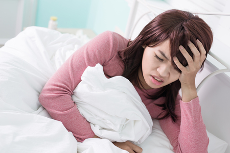 Sick Woman feel headache. Flu and Woman Caught Cold.の写真素材