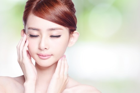 Beautiful Skin care woman enjoy and relax isolated on nature green background. asian Beautyの写真素材
