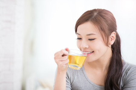 smile young woman holding cup of  green tea at home, healthy lifestyle concept, asian beauty, asian beauty