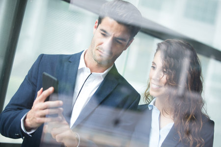 Business team meeting and look smart phone, caucasianの写真素材