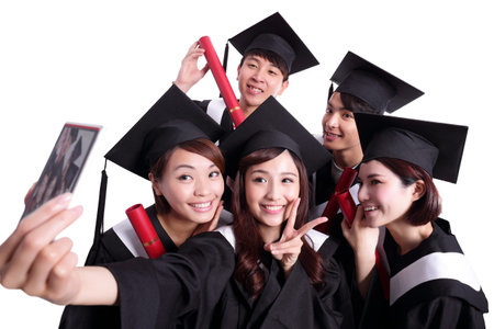 Selfie - group of happy graduates student taking pictures by themselves isolated on white background, asianの写真素材