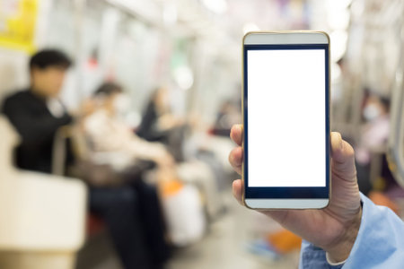 business man use the smart phone in the train, shot in japan