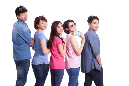 Happy teenagers take passport with isolated on white background, asianの写真素材