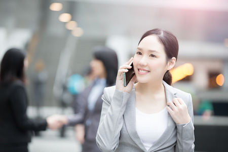 businesswoman talk on the phone in hongkongの写真素材