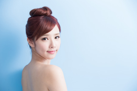 beauty woman smile to you isolated on bluebackground, asianの写真素材