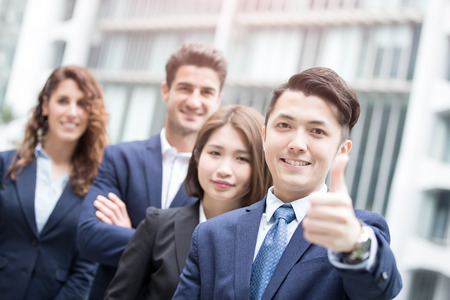 portrait of happy businessman smiles and show thumb up in hongkongの写真素材