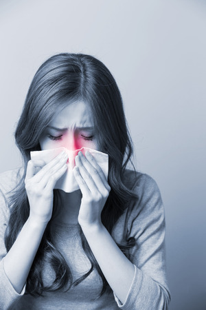 A Woman catches a cold, asianの写真素材