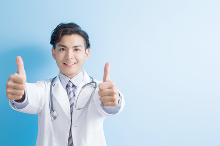 Male doctor show thumb up to you,asianの写真素材