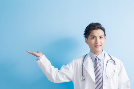 male doctor show something to you, asianの写真素材