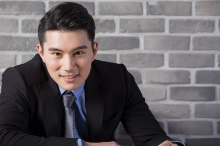 businessman smile to you in the office, asian