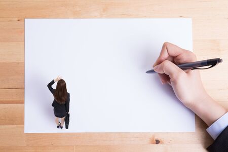 business woman stand on paper and thinking with white backgroundの写真素材