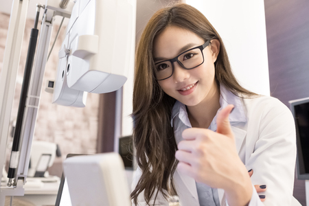 beauty woman optometrist smile happily and look youの写真素材