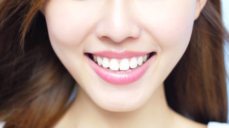 beauty woman smile happily with health teeth on blue backgroundの写真素材