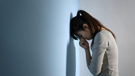 The depression woman feel sad and hammer the wall