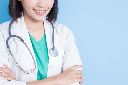 beauty woman doctor on the blue backgroundの写真素材