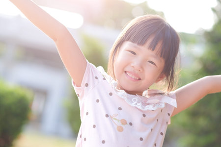 cute girl smile happily in the parkの写真素材