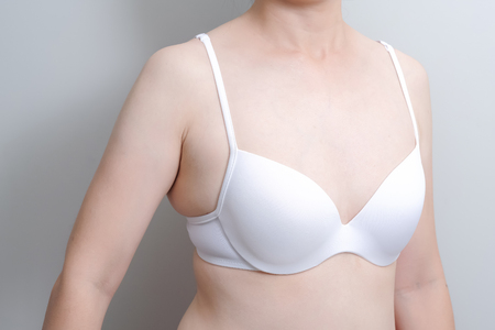 Fat overweight woman body with small underwear bra cupの写真素材