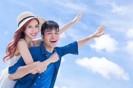 couple feel free and enjoy with blue skyの写真素材