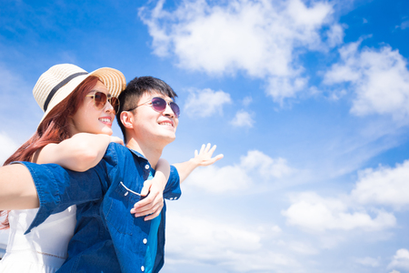 couple feel free and enjoy with blue skyの写真素材