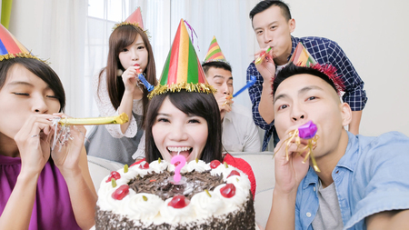 people smile happily with birthday party in the homeの写真素材