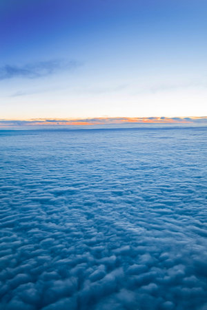 Flying above the clouds view from the airplane
