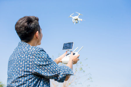 asia man play drone in the outdoor