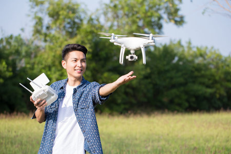 asia man play drone in the outdoor