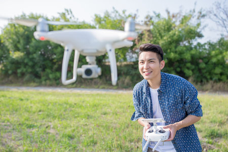 asia man play drone in the outdoor