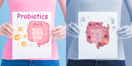 woman take intestine billboard on the blue backgroundの写真素材