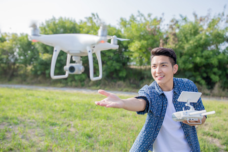 asia man play drone in the outdoorの写真素材