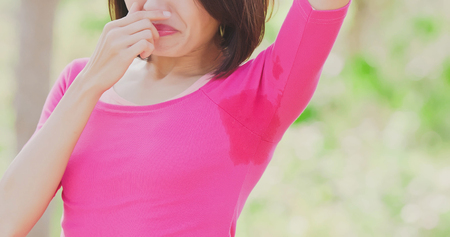 woman with body odor problem with outdoorの写真素材