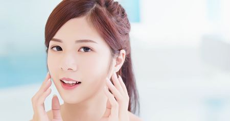 beauty skin care woman in the bathroomの写真素材
