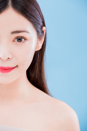 beauty skincare woman look you and smile happily on the blue backgroundの写真素材