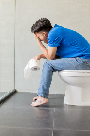 man feel pain with constipation in wcの写真素材