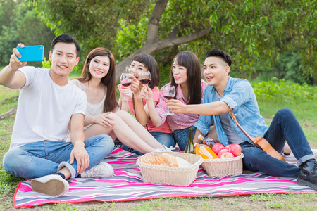 people selfie happily in the outdoor and go on picnicの写真素材