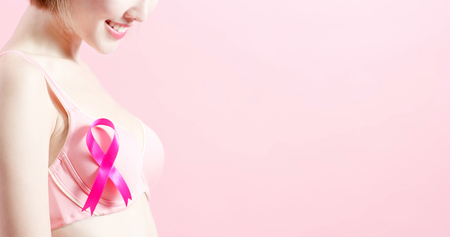 woman wear pink ribbon with prevention breast cancer conceptの写真素材