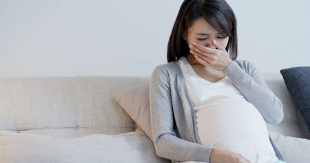 pregnant woman cry and feel depression at homeの写真素材