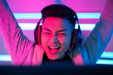 Young Asian Handsome Pro Gamer win in Online Video Gameの写真素材