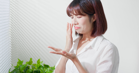 asian woman feel sad because her skin is very oilyの写真素材