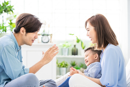 Happiness asian family - Young parent play with child happily at homeの写真素材