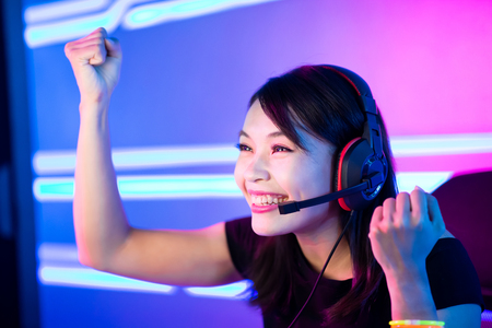 Young Asian Pretty Pro Gamer win in Online Video Gameの写真素材